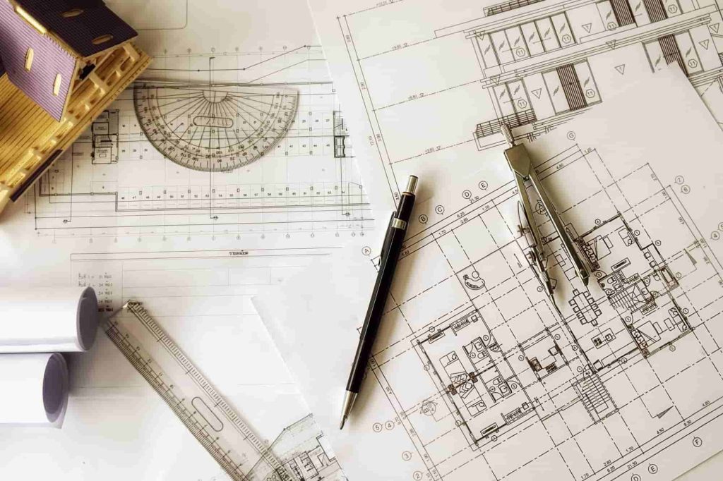 Eine Zusammenstellung von Designtools und Architekturplänen, die Präzisionsdesign in einer CAD-Umgebung darstellen