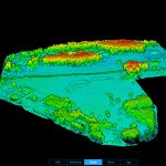 Aerial view of a large 247-acre landscape mapped with LiDAR drone scanning technology for resort planning, showing detailed elevation changes, tree density, and lake proximity for optimal cabin placement.