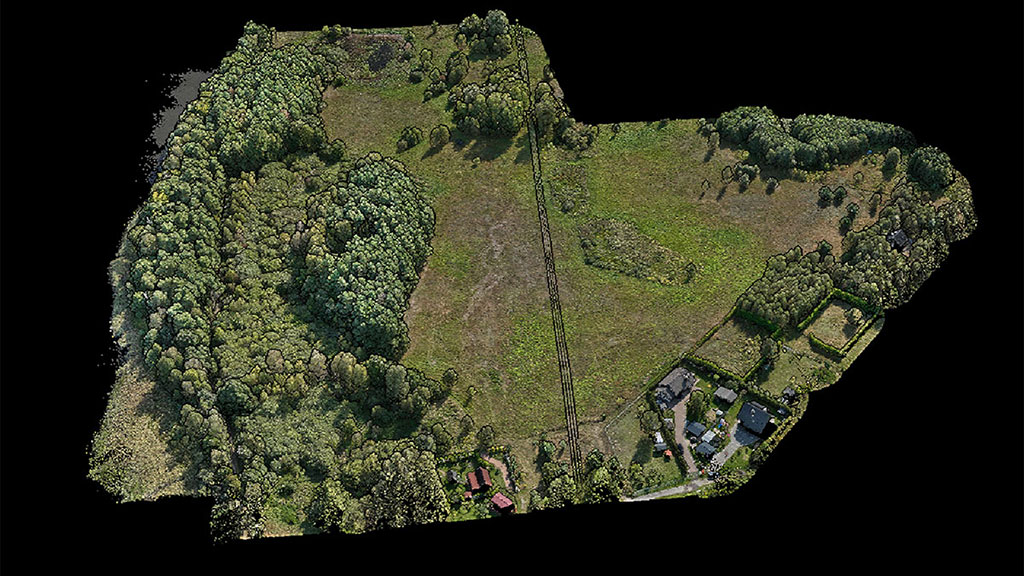 Aerial view of a large 247-acre landscape mapped with LiDAR drone scanning technology for resort planning, showing detailed elevation changes, tree density, and lake proximity for optimal cabin placement.