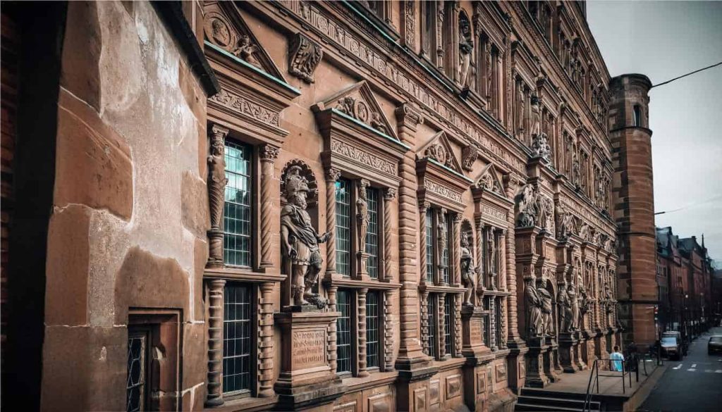 **Alt Text:**  
Facade of a historic building with carvings and statues — showcasing the importance of as-built services for preserving heritage.