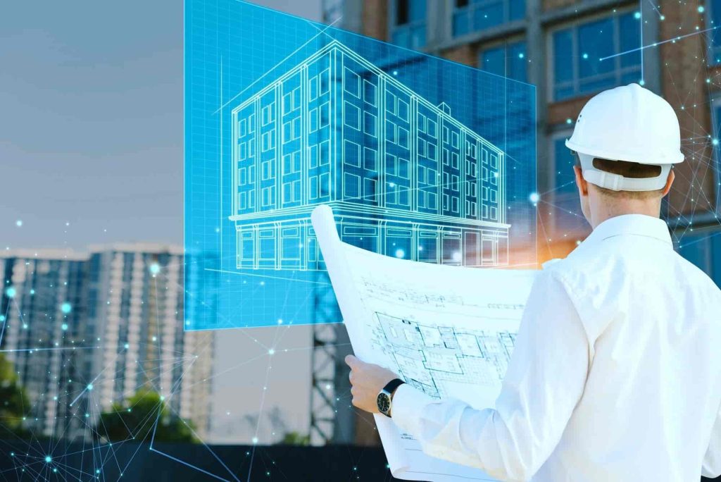 Engineer reviewing as-built plans with a 3D building model.