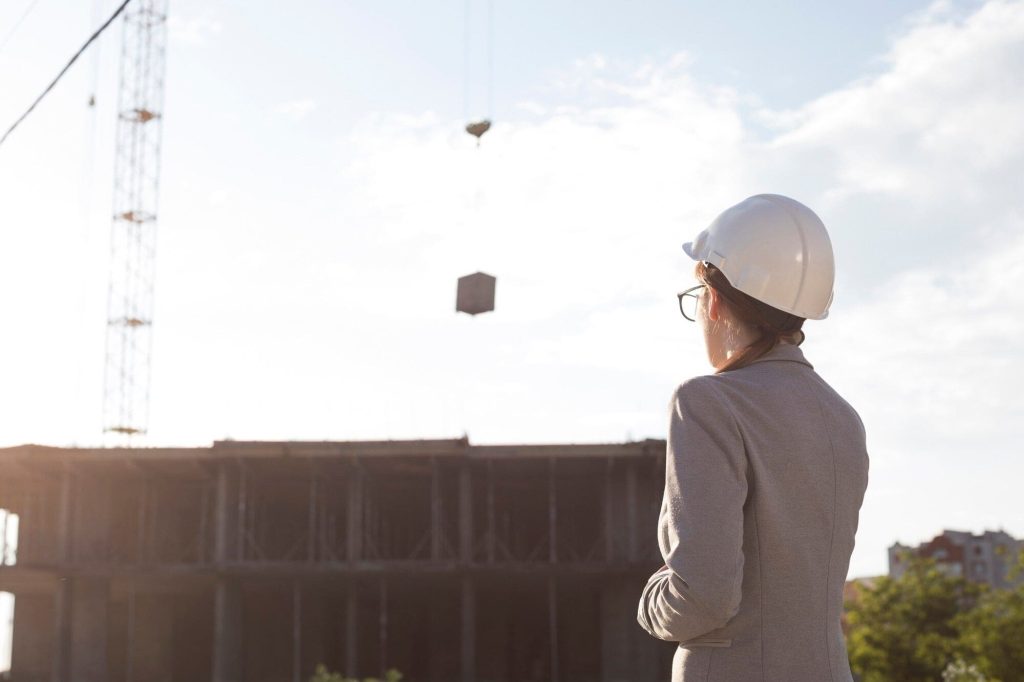 Engineer evaluating a construction site for renovation accuracy.